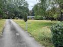 Brick ranch house with a long driveway at 5297 Rock Springs Rd, Lithonia, GA 30038