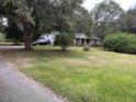 Brick ranch house with a large yard at 5297 Rock Springs Rd, Lithonia, GA 30038