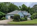 Ranch style home with attached garage and landscaped yard at 3725 Post Rd, Cumming, GA 30040