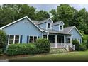 Two-story house with a covered porch at 3725 Post Rd, Cumming, GA 30040
