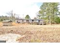 Mobile home with deck and storage shed on spacious lot at 1815 S Ola Rd, Locust Grove, GA 30248
