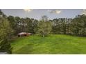 Large lot with a red barn and open pasture, perfect for animals at 540 Lepard Rd, Roopville, GA 30170