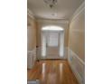 Bright entryway with hardwood floors and white door at 1995 Evergreen Se Dr, Conyers, GA 30013