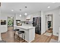 Renovated kitchen with white cabinets, quartz countertops, and stainless steel appliances at 4505 Cochran Mill Rd, Fairburn, GA 30213