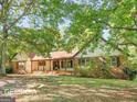 Ranch style home with mature landscaping and trees at 3655 Highway 81 W, Hampton, GA 30228