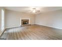Living room with hardwood floors and a stone fireplace at 267 Wellington Walk, Douglasville, GA 30134