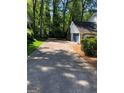 Long driveway leading to a two-car garage at 2692 Peppermint Dr, Tucker, GA 30084