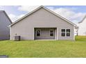 Covered patio with grassy backyard at 153 Avondale Blvd, Conyers, GA 30013