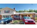 Two-story house with red brick and tan siding at 5110 Macland Rd, Powder Springs, GA 30127