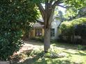 House exterior partially visible through trees at 960 Stone Mountain Lithonia Rd, Lithonia, GA 30058
