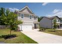 Two-story house with gray siding, white garage door, and a basketball hoop at 6904 Oak Valley Dr, Douglasville, GA 30134