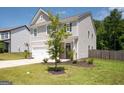 Two-story house with gray siding, white garage door, and a basketball hoop at 6904 Oak Valley Dr, Douglasville, GA 30134