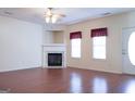 Living room with corner fireplace and hardwood floors at 110 Emily Park, Fayetteville, GA 30215