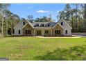 Two-story house with stone accents and a large front yard at 831 Banks Cir, Carrollton, GA 30116