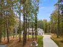 House nestled in a wooded area with a long driveway at 831 Banks Cir, Carrollton, GA 30116