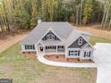Aerial view of two-story house with large backyard and driveway at 1797 Star Point Rd, Carrollton, GA 30116