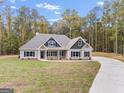 Two-story house exterior, two-car garage, front yard, driveway at 1797 Star Point Rd, Carrollton, GA 30116