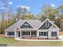 Two-story house exterior, two-car garage, front yard, driveway at 1797 Star Point Rd, Carrollton, GA 30116