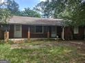 Brick ranch house with a covered porch at 1030 Mundys Mill Rd, Jonesboro, GA 30238