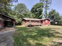 Brick ranch house with a deck and detached garage at 1030 Mundys Mill Rd, Jonesboro, GA 30238