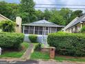 House exterior showcasing a screened porch and walkway at 988 Herndon Nw St, Atlanta, GA 30318