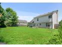 Spacious backyard with a large grassy area at 3463 Madison Farm Way, Snellville, GA 30039