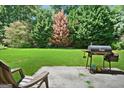 Cozy patio area with a grill and plenty of space for relaxation at 3463 Madison Farm Way, Snellville, GA 30039