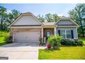 Ranch home features gray siding, brick accents, and a welcoming front porch at 442 River Bluff Dr, Temple, GA 30179