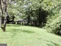 Brick ranch home situated on a large lot with lush lawn at 2093 Wildrose Dr, Decatur, GA 30032