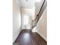 Bright entryway with staircase and hardwood floors at 5716 Laney Dr, Rex, GA 30273