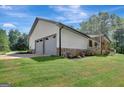 Ranch home with attached two-car garage at 2752 Poplar Rd, Sharpsburg, GA 30277
