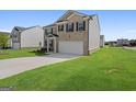 Two-story home with a large front yard at 104 Montgomery Dr, Stockbridge, GA 30281