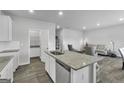 Modern kitchen with granite countertops and stainless steel appliances at 114 Jacoby Dr # 111, Fairburn, GA 30213