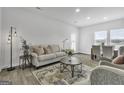 Bright living room with comfortable seating and dining area at 114 Jacoby Dr # 111, Fairburn, GA 30213