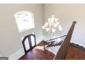 Elegant foyer with hardwood floors and chandelier at 230 Waltham Way, Fayetteville, GA 30214