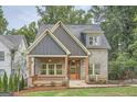 Modern two-story home with gray siding and a front porch at 1055 Church St, Smyrna, GA 30080