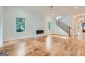 Spacious living room with hardwood floors and a modern fireplace at 1055 Church St, Smyrna, GA 30080