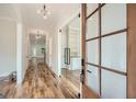Bright entryway with hardwood floors and glass French doors at 1055 Church St, Smyrna, GA 30080