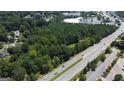 Aerial view of a large wooded lot near a road at 4556 Wade Green Nw Rd, Acworth, GA 30102