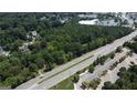 Aerial view of a large wooded lot near a road at 4556 Wade Green Nw Rd, Acworth, GA 30102