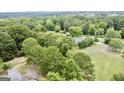 Aerial view of the house and surrounding landscape at 1092 Harbins Rd, Dacula, GA 30019