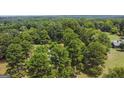 Aerial view of property showcasing house and lush green landscape at 1072 Harbins Rd, Dacula, GA 30019