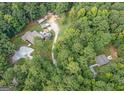 Aerial view of a property with two buildings and a long driveway at 331 Clearwater Rd, Sharpsburg, GA 30277