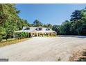 House exterior from a distance showcasing landscaping at 371 Oakland Rd, Mcdonough, GA 30253