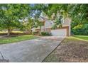 Two-story house with brick and siding, attached garage, and landscaping at 519 Crimson Ridge Dr, Jonesboro, GA 30238