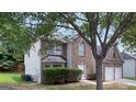 Two-story brick house with a two-car garage and neatly trimmed hedges at 3752 Arminto Dr, Ellenwood, GA 30294