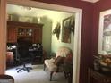 Home office with built-in shelving and comfortable seating at 1145 Lake Stone Lea Dr, Oxford, GA 30054