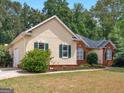 Ranch style home with brick and stucco exterior at 1380 Jenkinsburg Rd, Locust Grove, GA 30248