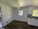 Renovated kitchen with white cabinets, granite counters, and stainless steel appliances at 2101 Ann Se Ct, Conyers, GA 30013