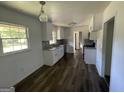 Renovated kitchen with white cabinets, granite counters, and stainless steel appliances at 2101 Ann Se Ct, Conyers, GA 30013
